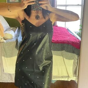 Elegant Black pleather Dress with rhinestone Embellishments.